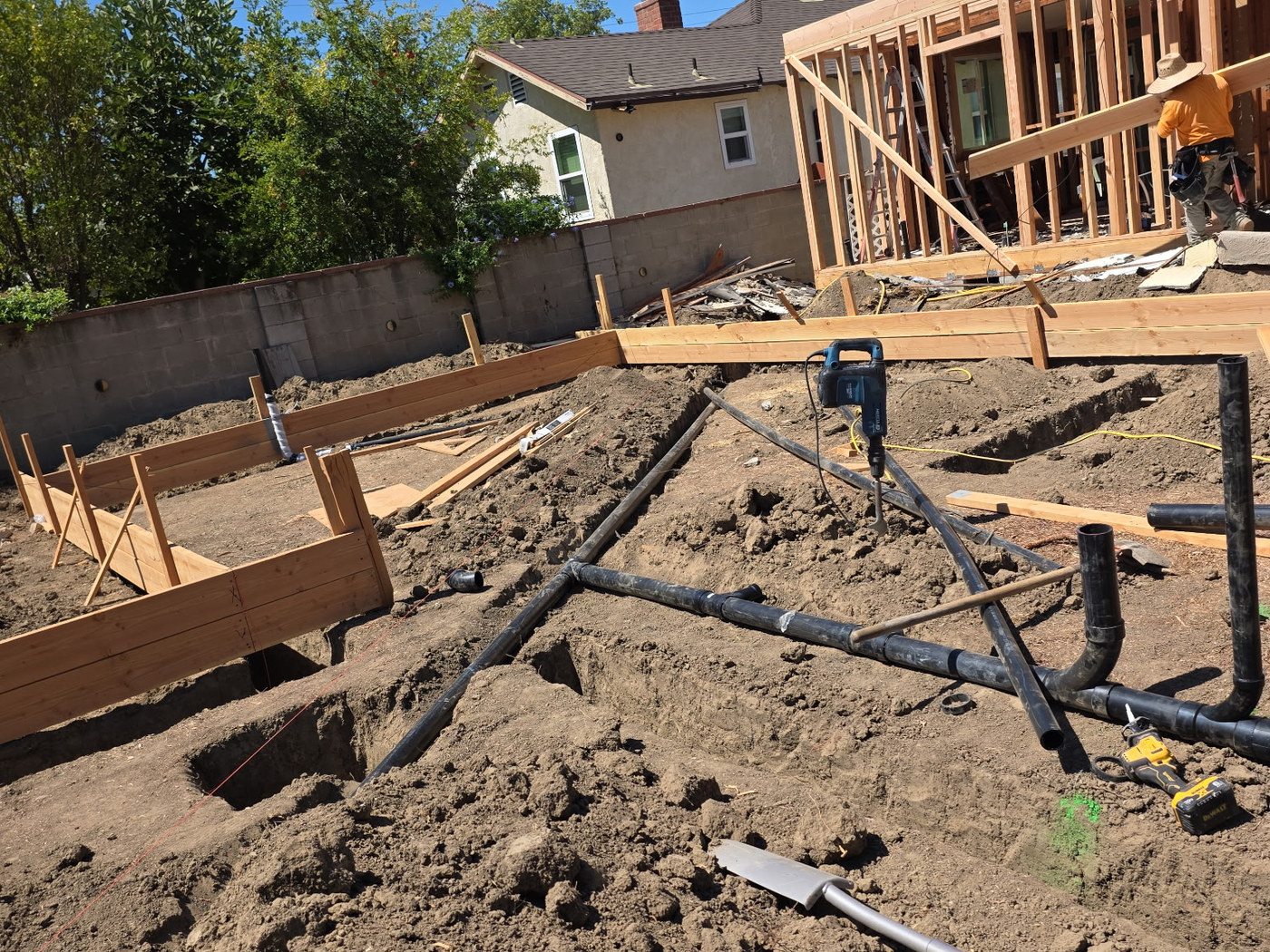 Construction site with foundation in progress.